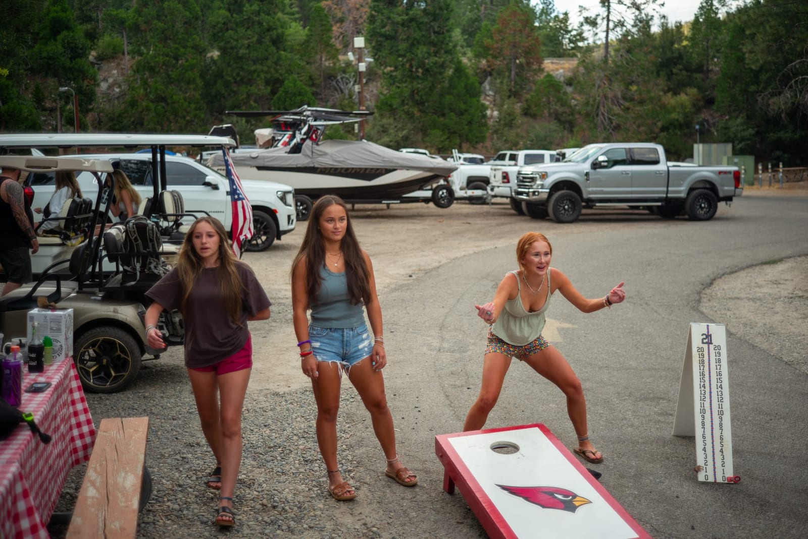 Guests playing cornhole in the campground at Outdoorsy Yosemite