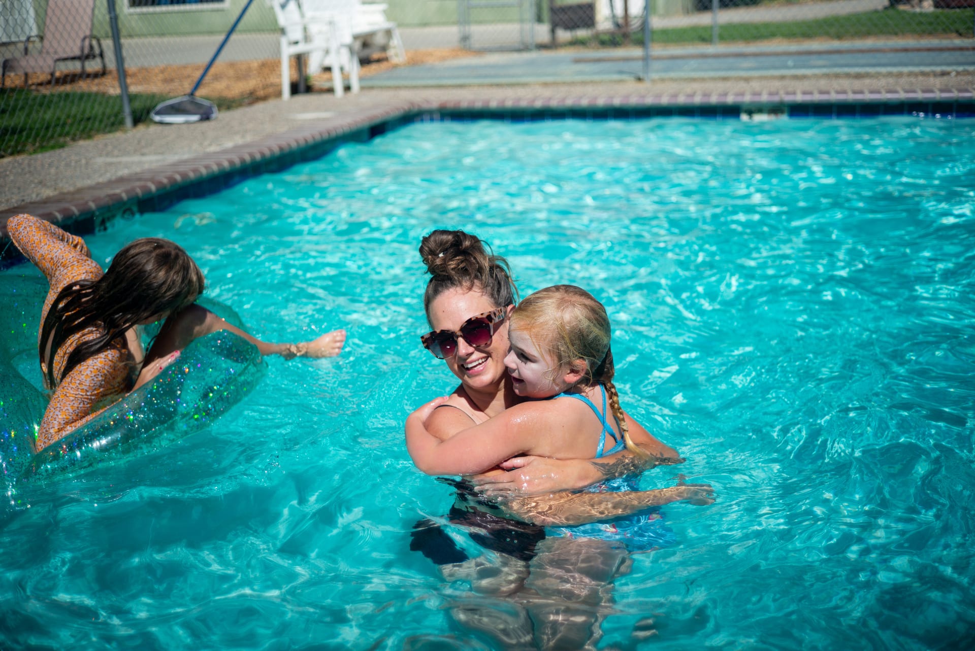 A mother and children in the seasonal pool at Outdoorsy Yosemite