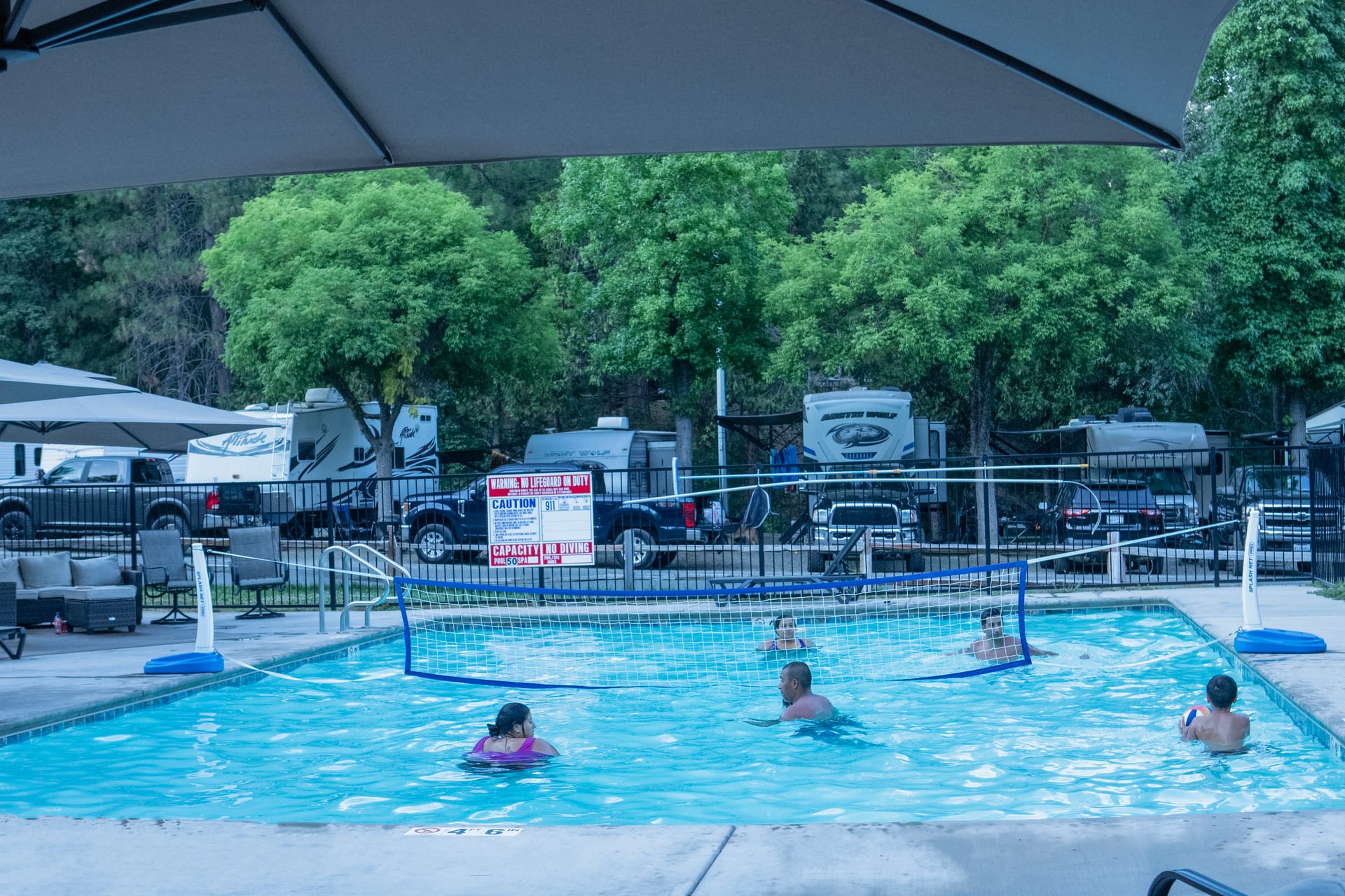 Guests in the seasonal pool at Outdoorsy Yosemite