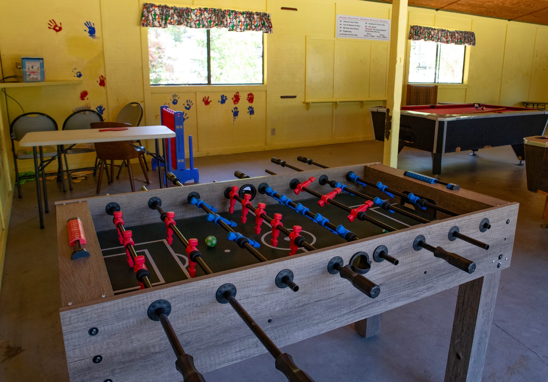 Kids Clubhouse interior with foosball and pool tables at Outdoorsy Yosemite